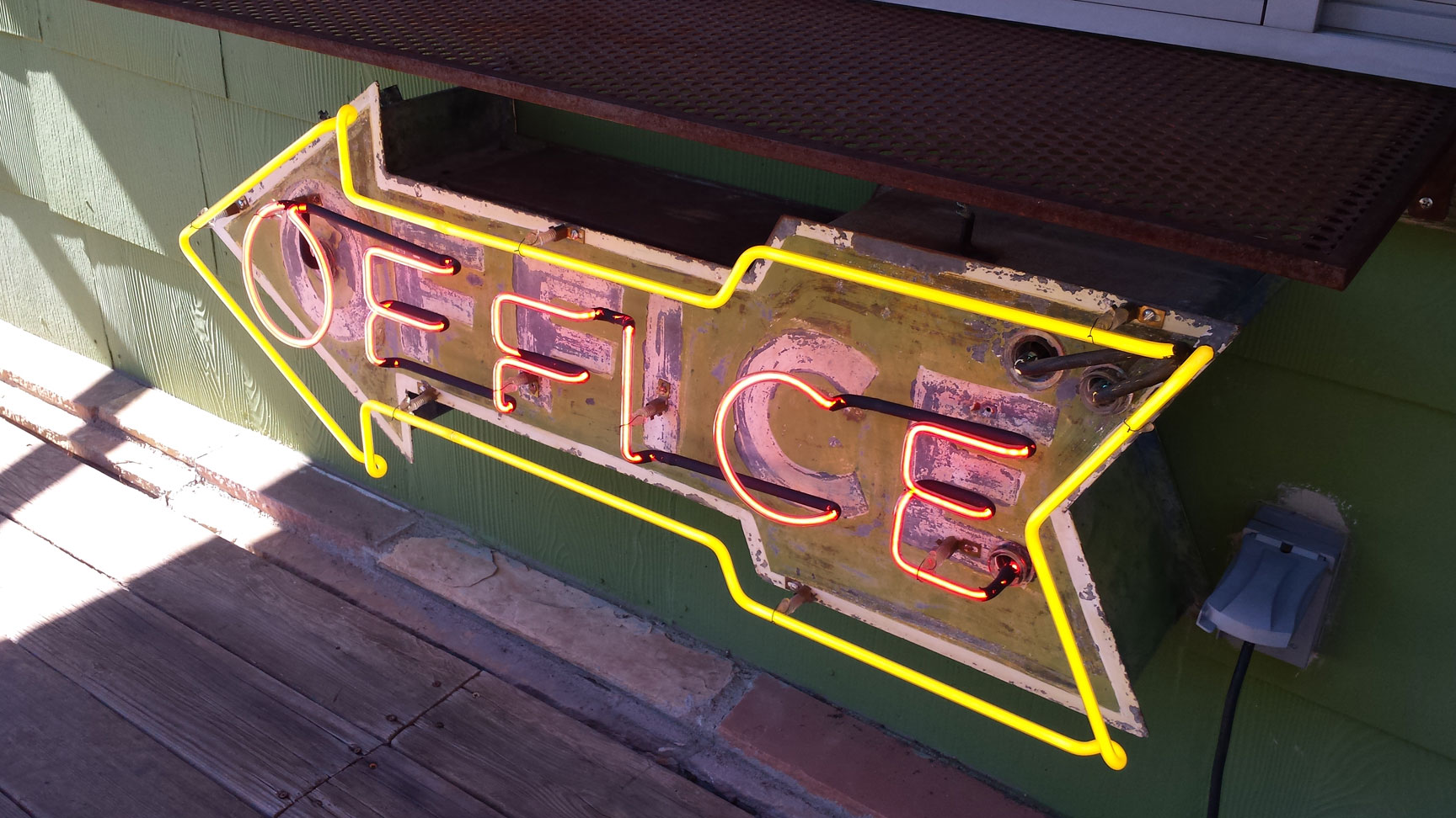 Loved the neon office sign on the community porch!