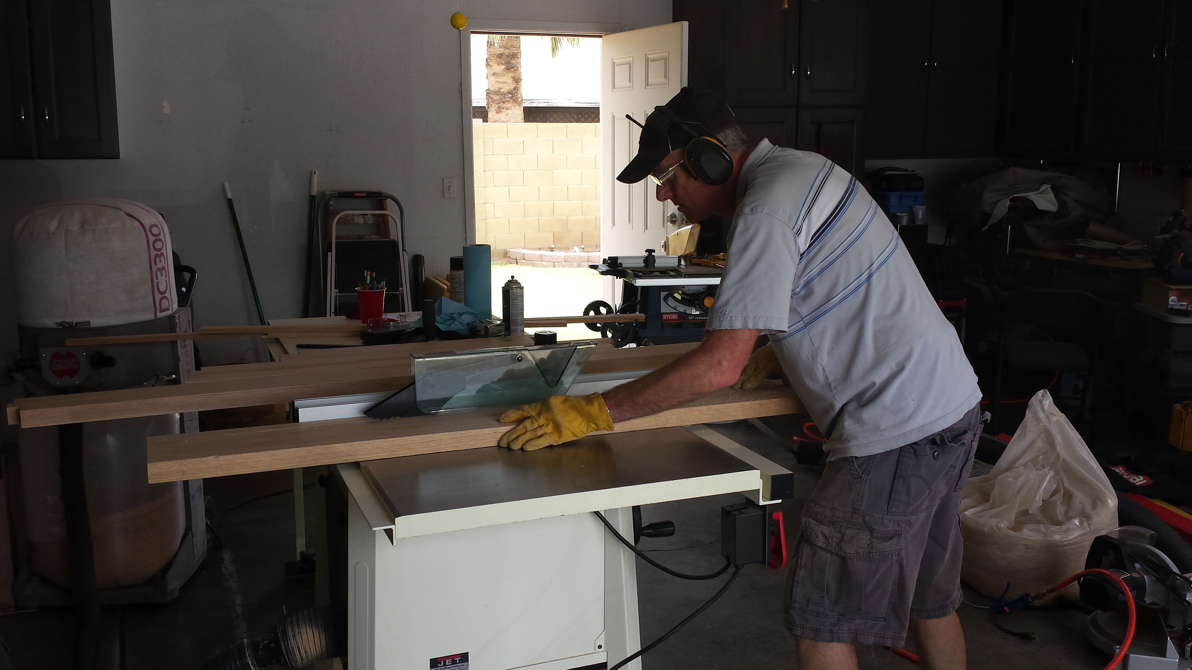 My dad cutting the legs for the dresser.